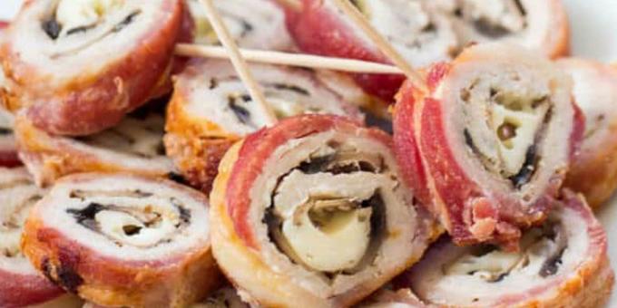 Carne de cerdo en el horno: Rolls del cerdo envuelto en tocino rellenos de champiñones y queso