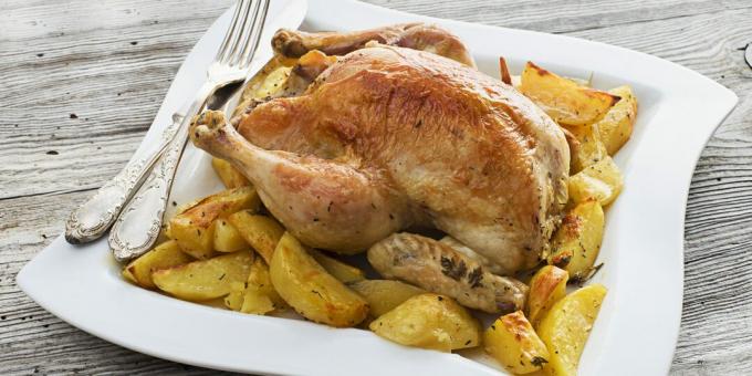 Pollo entero con patatas y orégano al horno